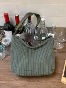 Large dark green checkerboard canvas hobo bag with a stylish casual crescent design