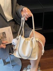 Chic cream white pleated cloud bag with silver chain and cute plush charm detail