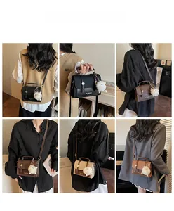 Detail showing vintage small crossbody bags in four colors with furry ball pendant charm