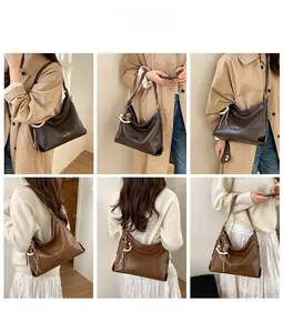 Detailed view of large leather tote bags in coffee and caramel with tassels and horse charm