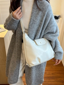 Minimalist white leather hobo shoulder bag with a magnetic flap closure for women