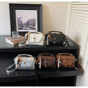 Collection of retro small square crossbody bags in five colors with beaded pendants