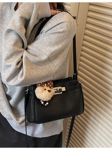 Minimalist black litchi pattern shoulder bag with silver metal buckle and bear charm