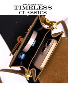 Internal view of brown litchi pattern crossbody bag with phone and lipstick items
