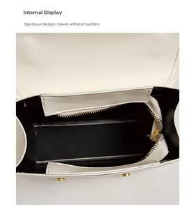 Internal view of the white flap bag showing large capacity and smooth zipper detail