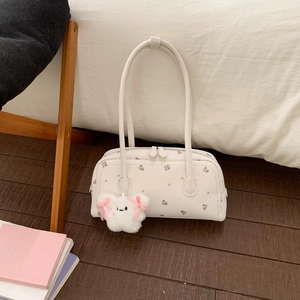 White floral Boston bag with a cute teddy bear charm and top double zipper closure