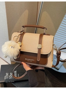 Retro canvas and brown leather crossbody bag with brand logo and plush lamb pendant
