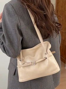 Retro beige leather tote bag with pleated texture and silver buckle for women's daily commute