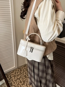 Elegant white square vanity box bag with top handle and adjustable shoulder strap