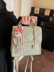 Mint green PU leather backpack with marble texture flap and plush bear charm