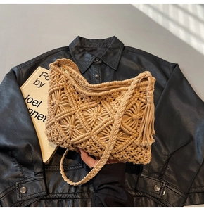 Close-up of hand-woven crossbody bag with geometric patterns and long side tassels