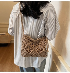 Detail of bohemian woven bag featuring hollow diamond patterns and stylish side tassels