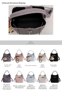 Detail view of lychee pattern leather bucket bags in five colors with metal twist locks