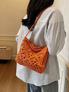 Orange handmade crochet woven shoulder bag with fringe tassel and diamond pattern