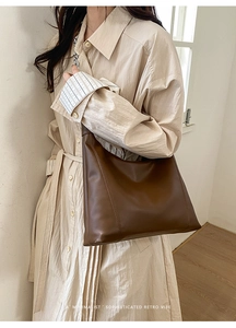 Brown large capacity shoulder bag with silver chain detail and sleek matte texture