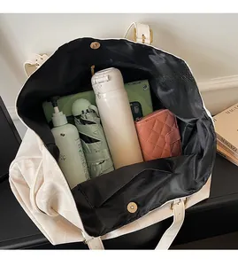 Large capacity tote bag interior with magnetic closure and organized daily essentials