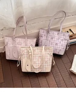 Detailed view of plaid tote bags featuring cute bear prints and matching small purses