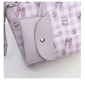 Detail of the purple plaid tote bag showing the detachable small card holder pouch
