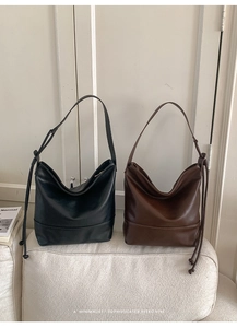 Detailed texture of minimalist matte leather hobo bags in black and dark brown