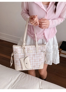 Detail of pink plaid tote bag featuring cute cartoon bear patterns and mini hanging pouch
