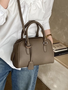 Classic taupe pebble leather Boston bag with silver hardware and adjustable shoulder strap