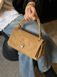 Classic camel suede flap handbag with gold metal twist lock and knot handle detail