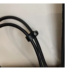 Close-up of premium polished silver hardware on a black leather baguette shoulder bag