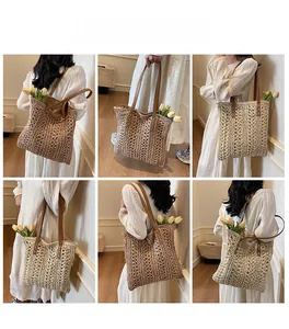 Detail view of woven straw tote bag with brown PU straps for summer beach style