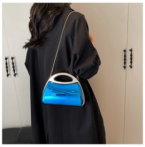 Blue acrylic clutch bag featuring a shiny metallic mirror finish and silver chain strap