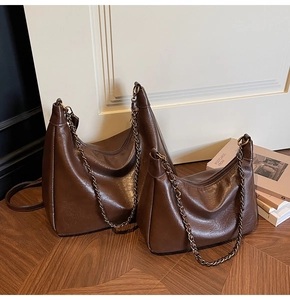 Detailed comparison of large and small retro brown faux leather tote bags with chains