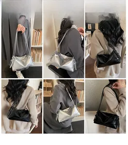 Chic metallic silver and glossy black shoulder bags displayed on a model in a library setting