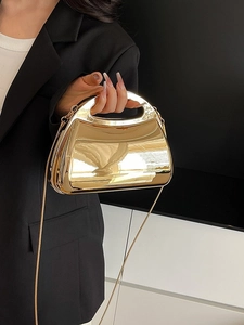 Chic gold acrylic box clutch bag with metallic mirror finish and sleek chain strap