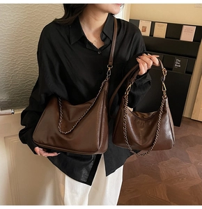 Comparison view of large and small retro brown leather tote bags with chain straps