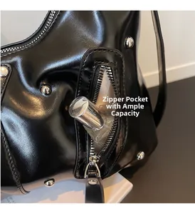 Detail of side zipper pocket on black PU leather tote showing storage for perfume bottles