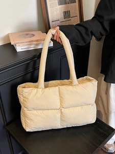 Quilted puffer tote bag in beige with a spacious design and wide shoulder straps
