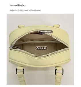 Top view of yellow bowling bag interior with main compartment and zipper pocket