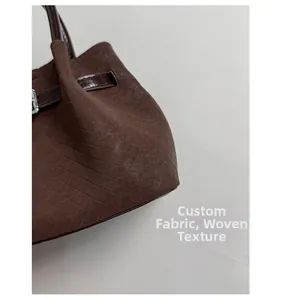 Detailed macro view of woven leather texture and dark leather strap with metal buckle