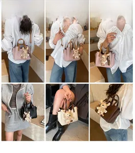 Detailed views of multi-colored faux leather handbags with bear charm and long straps