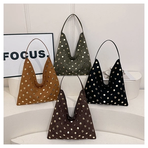 Detailed display of four studded hobo tote bags in suede textures on white pedestals
