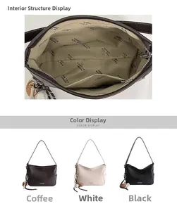 Detail view of the interior compartment and lining with logo for the vintage crossbody bag