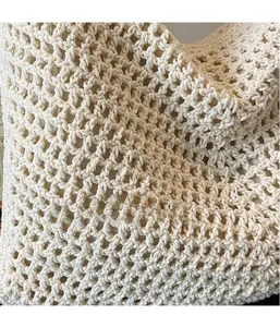 Close-up of the hollow knitted hollow texture and cotton lining on the beach tote bag