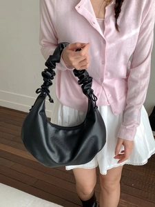 Minimalist black pleated crescent underarm bag with unique ruched handle for women