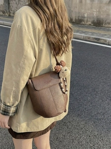 Brown retro PU leather messenger bag with cute bear charm and embossed fashion text