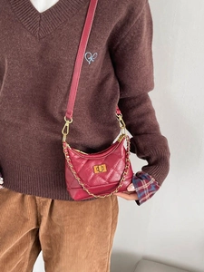 Retro red quilted mini shoulder bag with gold chain strap and rotary lock closure