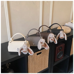Litchi pattern leather handbags in four colors featuring cute bunny plush charms