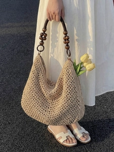 Hollow-out crochet tote bag with wooden bead handle for summer beach beachwear