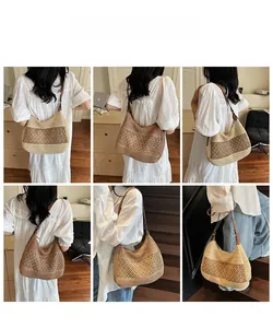 Hobo style straw shoulder bag featuring hollow weave and contrast patchwork design