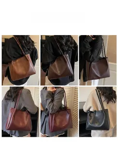 Detail view showing six color options of large tote bags with woven shoulder straps