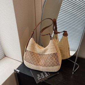 Minimalist straw woven hobo bag with hollow grid design and brown leather strap