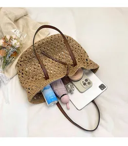 Overhead detail of a woven straw tote bag showing large capacity for daily essentials
